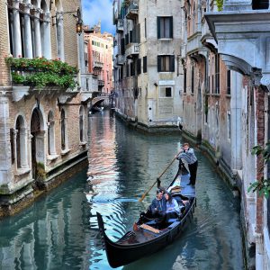 Romantic Couple in Gondola on Canal in Venice, Italy - Encircle Photos