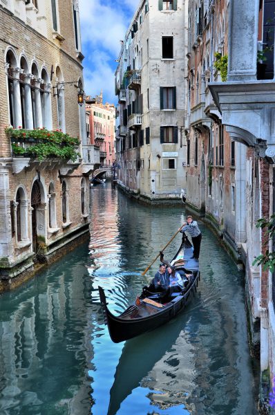 Romantic Couple in Gondola on Canal in Venice, Italy - Encircle Photos