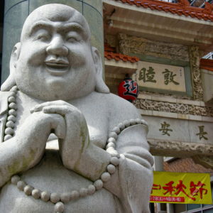 Laughing Buddha at Nankinmachi in Kobe, Japan - Encircle Photos
