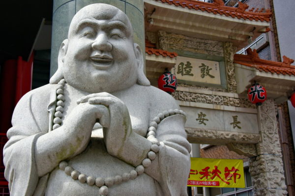 Laughing Buddha at Nankinmachi in Kobe, Japan - Encircle Photos