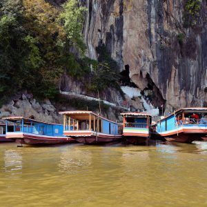 Slow Boats at Pak Ou Caves Entrance in Ban Pak Ou, Laos - Encircle Photos