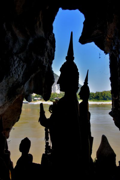Silhouettes of Buddhist Statues at Pak Ou Caves in Ban Pak Ou, Laos - Encircle Photos