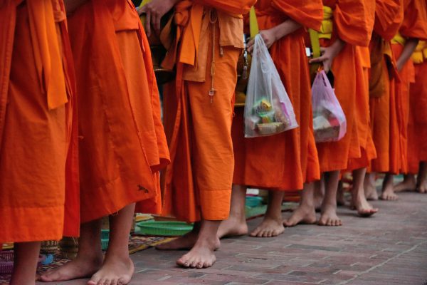 Barefoot Monks Walking at Dawn in Luang Prabang, Laos - Encircle Photos