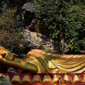 Reclining Buddha Represents Nirvana on Mount Phousi in Luang Prabang, Laos - Encircle Photos