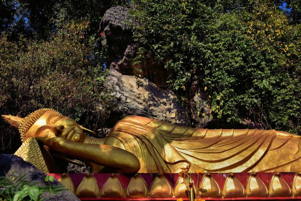 Reclining Buddha Represents Nirvana on Mount Phousi in Luang Prabang, Laos - Encircle Photos