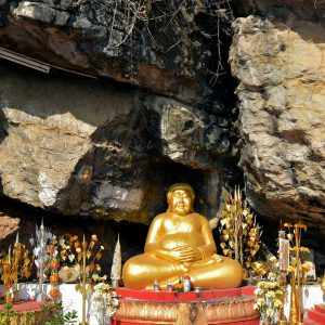 Three Buddha Statues in Grotto on Mount Phousi in Luang Prabang, Laos - Encircle Photos