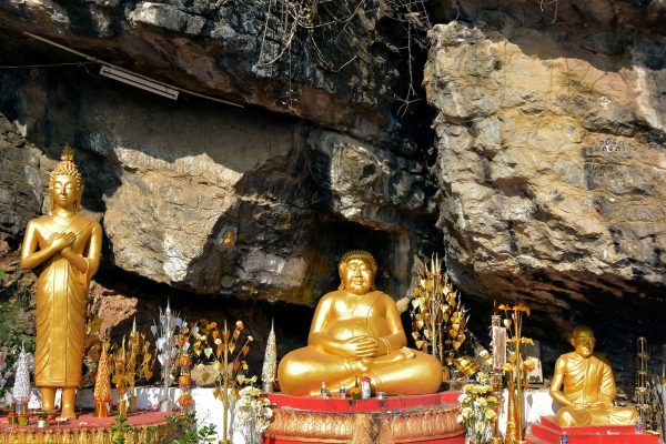 Three Buddha Statues in Grotto on Mount Phousi in Luang Prabang, Laos - Encircle Photos