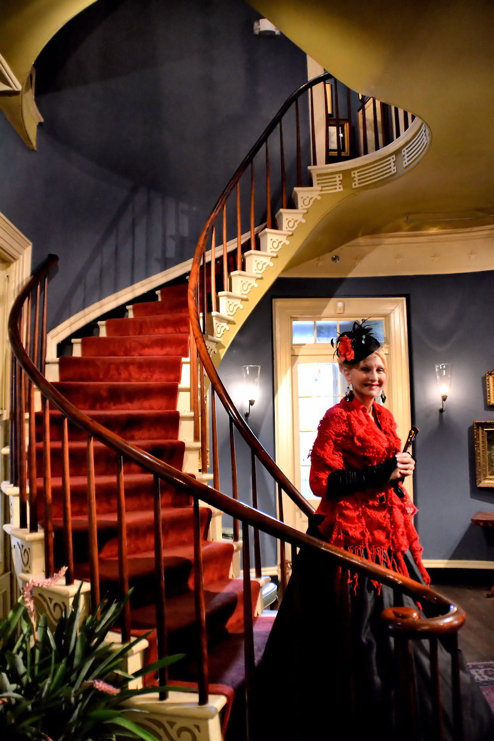 Southern Belle on Curved Staircase in a Plantation in Darrow, Louisiana - Encircle Photos
