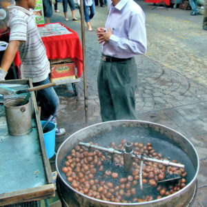 Roasting Chestnuts at Petaling Street in Kuala Lumpur, Malaysia - Encircle Photos