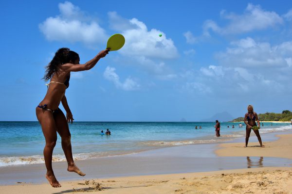 Women Playing Paddleball at Salines Beach near Sainte-Anne, Martinique - Encircle Photos