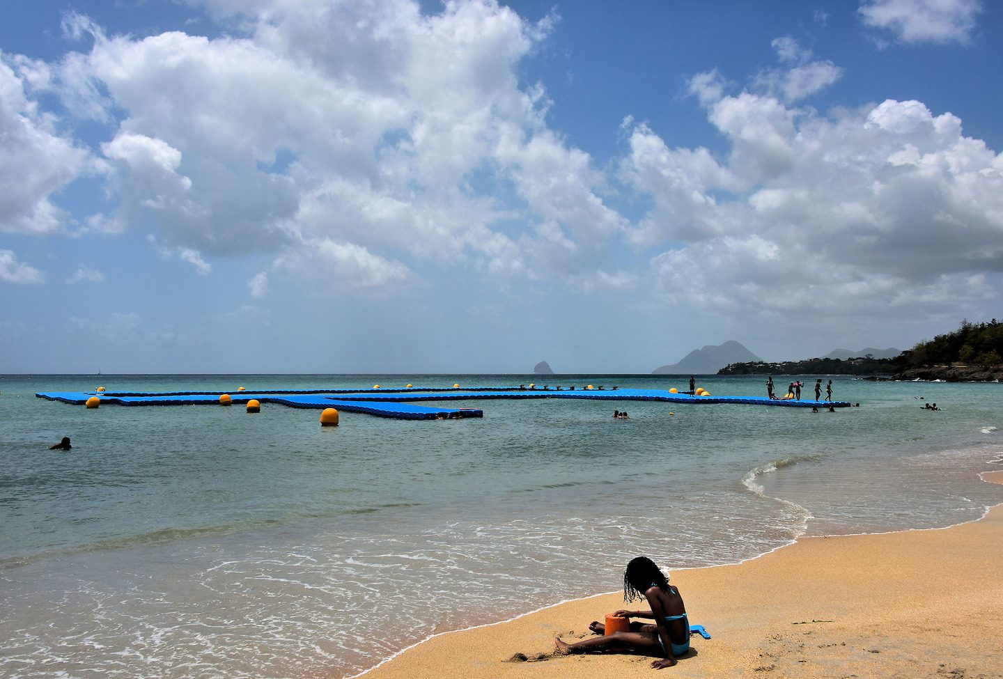 Girl Playing in the Sand at Anse Corps de Garde near Sainte Luce