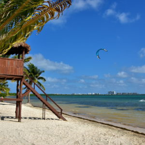 Kiteboarding along Coral Beach in Cancun, Mexico - Encircle Photos