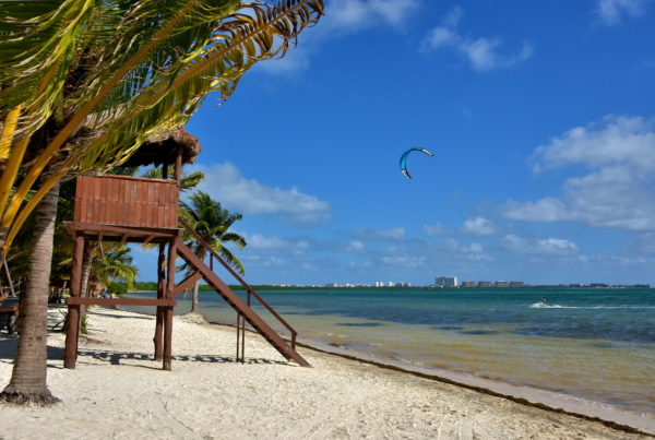 Kiteboarding along Coral Beach in Cancun, Mexico - Encircle Photos