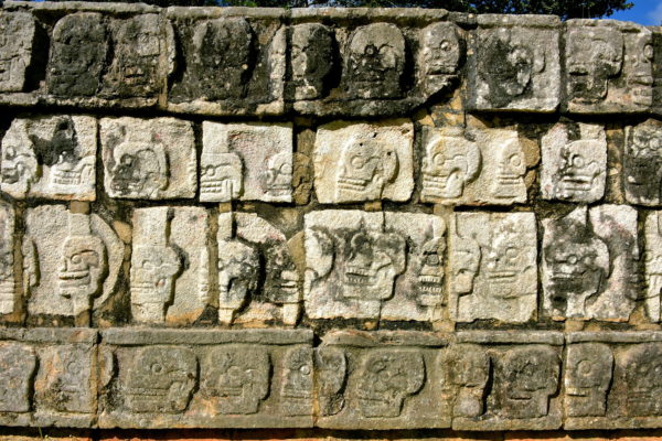 Wall of Skulls along El Tzompantli at Chichen Itza, Mexico - Encircle Photos