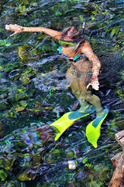 Woman Snorkeling at Gran Cenote near Cobá,  Mexico - Encircle Photos