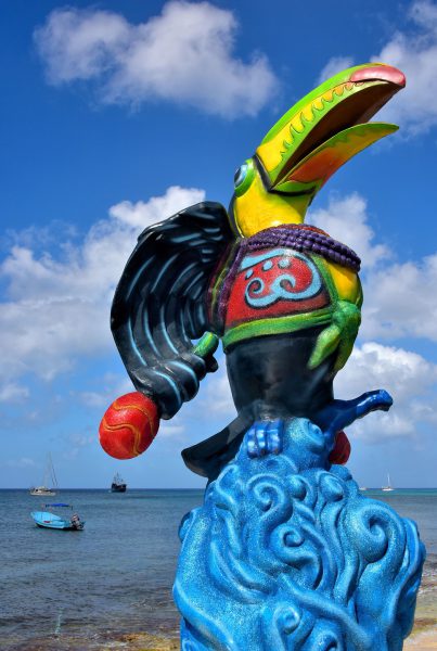 Toucan Holding Rattle Statue in San Miguel, Cozumel, Mexico - Encircle Photos
