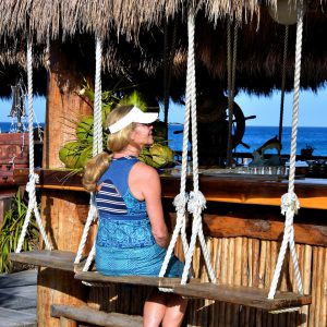 Woman Sitting at Outdoor Bar near San Miguel, Cozumel, Mexico - Encircle Photos