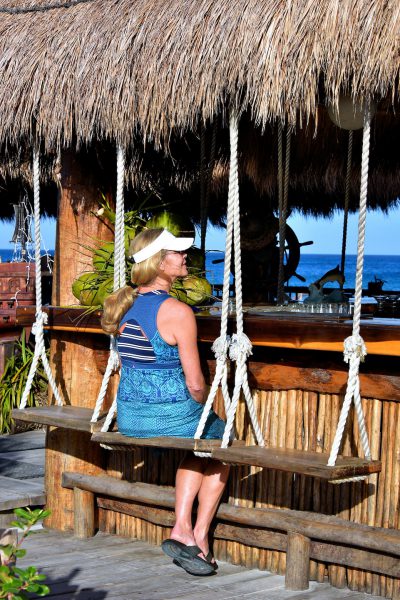 Woman Sitting at Outdoor Bar near San Miguel, Cozumel, Mexico - Encircle Photos