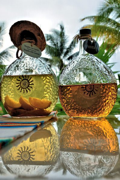 Tequila and Whiskey in Decanters at Riviera Maya, Mexico - Encircle Photos