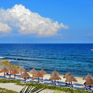 Thatched Umbrellas and Chaises on Beachfront at Riviera Maya, Mexico - Encircle Photos