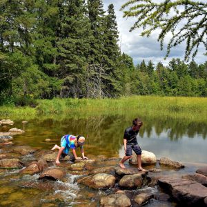 Boys Crossing Mississippi River Headwaters in Park Rapids, Minnesota - Encircle Photos
