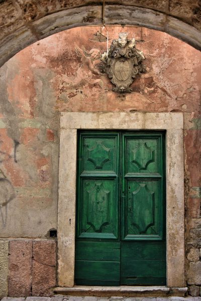 Door With Cherubs Fresco and Knight Relief in Kotor, Montenegro - Encircle Photos
