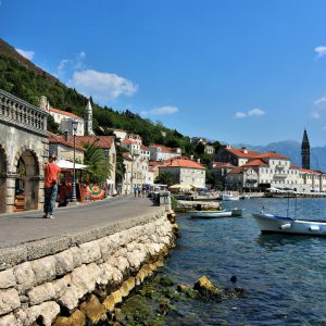 Woman Strolling Waterfront in Perast, Montenegro - Encircle Photos
