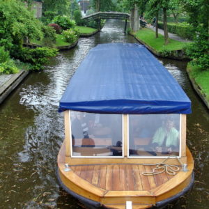 Sightseeing Boat on Canal in Giethoorn, Netherlands - Encircle Photos