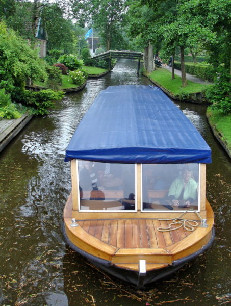 Sightseeing Boat on Canal in Giethoorn, Netherlands - Encircle Photos
