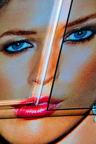 Woman with Blue Eyes, Red Lips Poster from Faces on the Strip at Las Vegas, Nevada - Encircle Photos