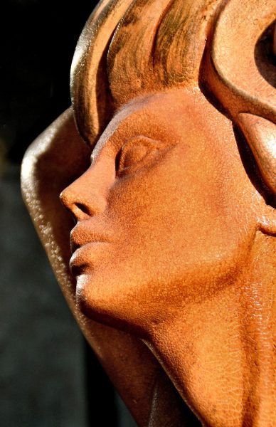 Woman Bronze-colored Sculpture Bust from Faces on the Strip at Las Vegas, Nevada - Encircle Photos