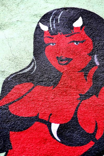 Red Devil Woman Wall Mural from Faces on the Strip at Las Vegas, Nevada - Encircle Photos