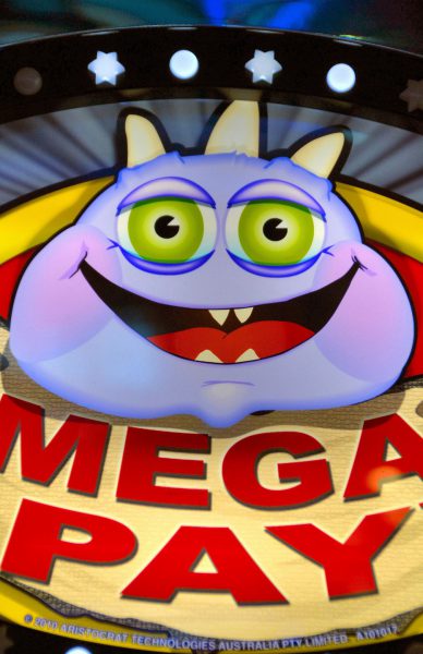 Purple Cartoon on Mega Pay Slot Machine from Faces on the Strip at Las Vegas, Nevada - Encircle Photos