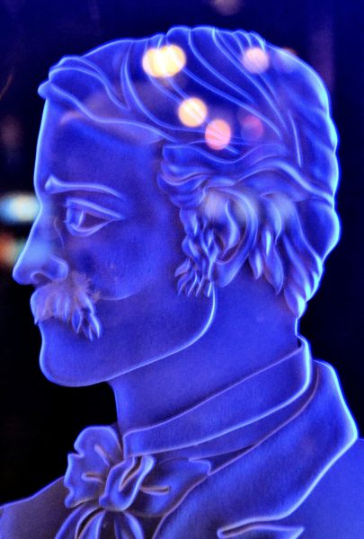 Purple Man Etched Glass with Reflections from Faces on the Strip at Las Vegas, Nevada - Encircle Photos