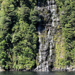 Waterfall along Acheron Passage at Fiordland, New Zealand - Encircle Photos