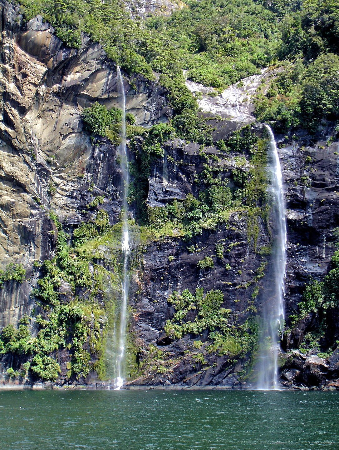 Four Sisters in Milford Sound at Fiordland, New Zealand - Encircle Photos