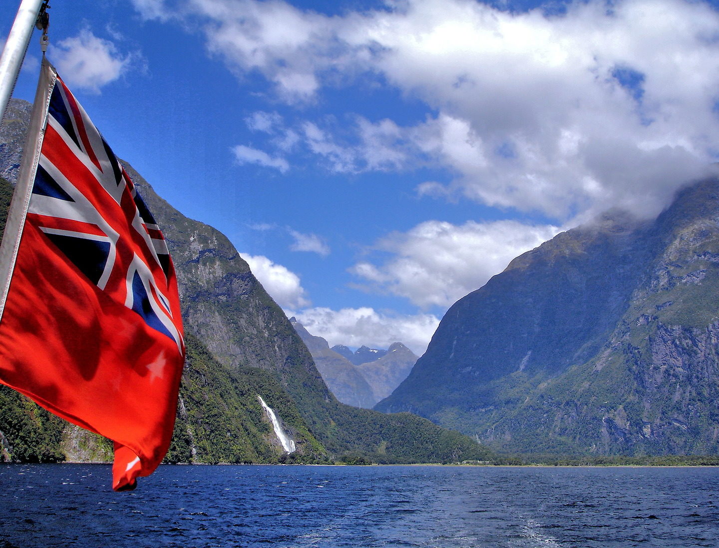 New Zealand Flag in Milford Sound at Fiordland, New Zealand - Encircle Photos