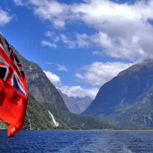New Zealand Flag in Milford Sound at Fiordland, New Zealand - Encircle Photos