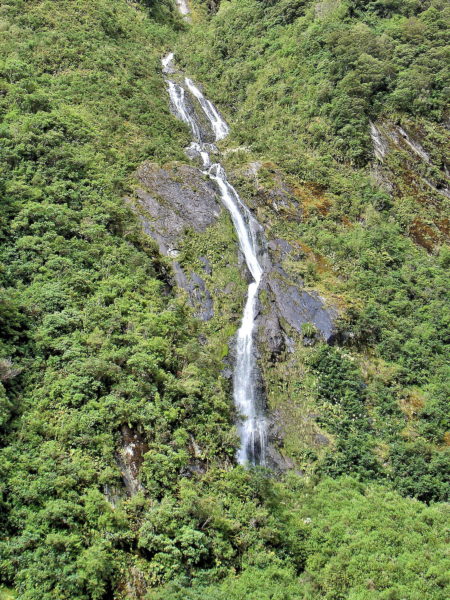 Waterfall near Franz Josef Glacier in Franz Josef, New Zealand - Encircle Photos