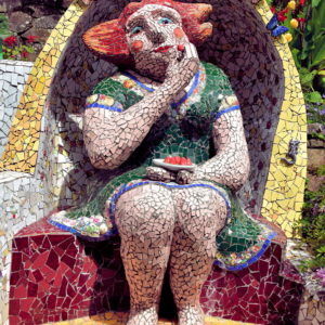 Woman Eating Berries Sculpture at Giant’s House in Akaroa, New Zealand - Encircle Photos
