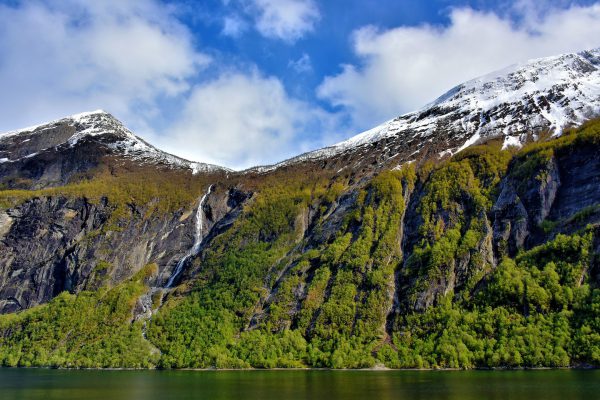 Waterfall Cascading Down Mountain at Geirangerfjord near Geiranger, Norway - Encircle Photos