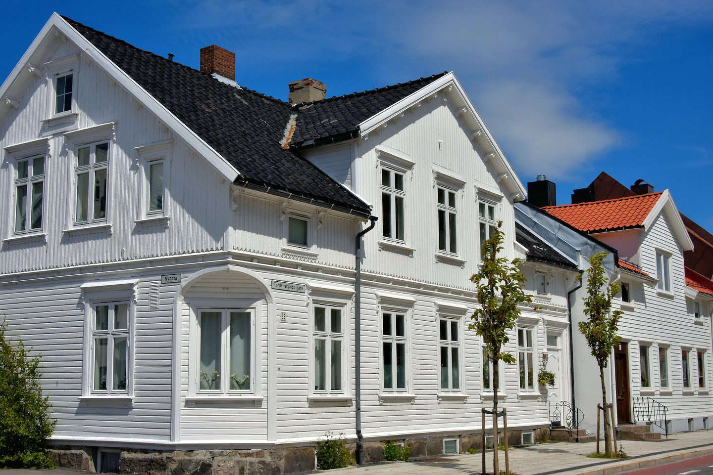 White Wooden Houses in Posebyen in Kristiansand, Norway Encircle Photos
