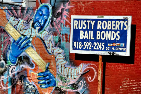 Guitar Player Mural by Anthony Carrera and Bail Bond Sign in Tulsa, Oklahoma - Encircle Photos