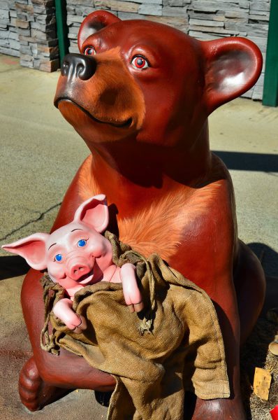 Bear Holding Pig Statue from BearFest in Grants Pass, Oregon - Encircle Photos