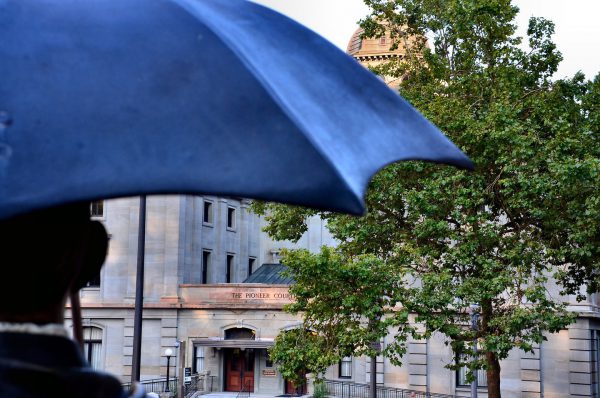 Allow Me Umbrella Man Statue in Portland, Oregon - Encircle Photos