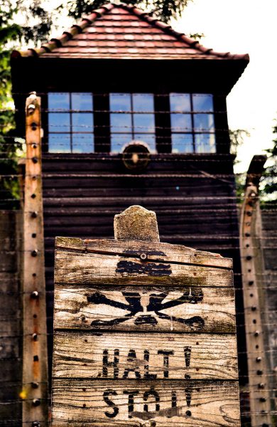 Skull and Crossbones Sign on Guard Tower at Auschwitz I Concentration Camp, Poland - Encircle Photos