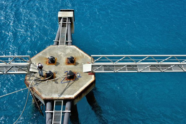 Port Worker Releasing Rope from Bollard in Phillipsburg, Sint Maarten - Encircle Photos