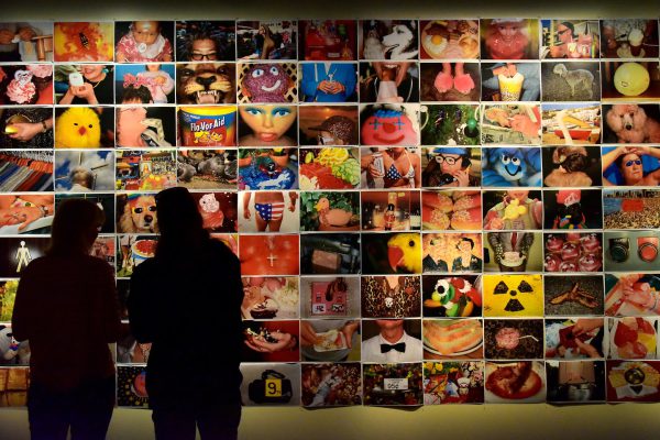Couple Admire Photos at Fotografiska in Stockholm, Sweden - Encircle Photos