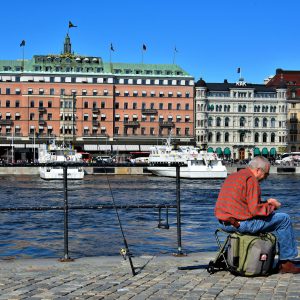 Fisherman at Strömparterren Park in Stockholm, Sweden - Encircle Photos