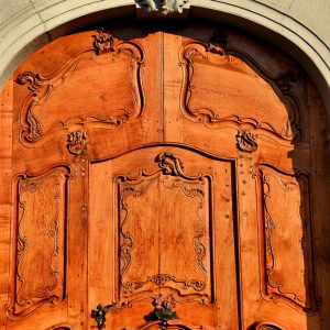 Wooden Door Facing Münsterplatz in Basel, Switzerland - Encircle Photos